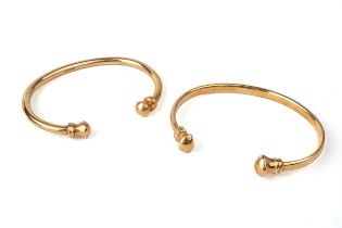 Two 9ct yellow gold torque bangles, total gross weight approx 46.5g Good condition, wear