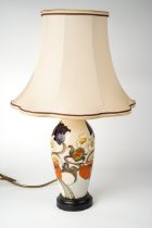 A Moorcroft 'Sandringham Bouquet' pattern lamp, designed by Emma Bossons, on a wooden base, approx