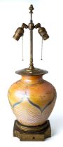 An American early 20th century large Durand Art Glass lamp base, fine iridescent peacock feather and