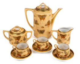 A Japanese eggshell teaset, comprising teapot, milk, sucrier and cover, three cups and saucers,