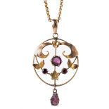 An Edwardian 9ct yellow gold and amethyst pendant and chain, set with three round cut amethyst