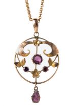 An Edwardian 9ct yellow gold and amethyst pendant and chain, set with three round cut amethyst