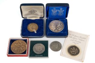 A collection of coins, including a sterling silver Royal Anniversary Medal, designed by David