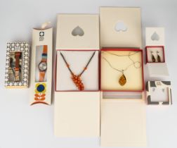 A silver and amber pendant necklace and earrings set; an amber coloured hardstone necklace; two Orla