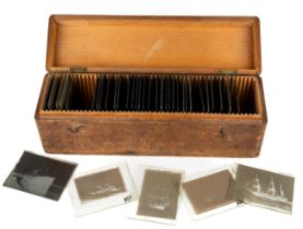 A collection of 37 Victorian and later glass plate negative slide photographs of ships in wooden box