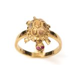 A novelty 14k gold tortoise ring, realistically cast as a tortoise with moving head and legs, rubies