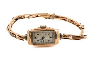 A ladies 9ct yellow gold wristwatch, the rectangular dial with Art Deco Arabic numerals,