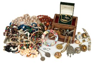 A collection of costume jewellery, including beads, necklaces, malachite, silver chains and