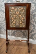 A Regency mahogany rise and fall fire screen, rectangular embroidered panel depicting vase and