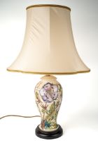 A Moorcroft 'Meadow Cranesbill' pattern baluster lamp, designed by Phillip Gibson, on a wooden base,