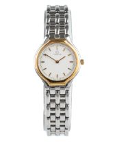A ladies 1980s Omega stainless steel wristwatch, circular white dial with baton indicators, gold