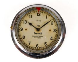 A Smiths bezel wind car clock in chrome case, approx 7.3cm diameter Currently ticking but no