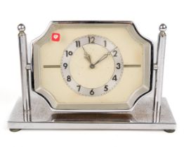 A 30 hour chrome desk clock, on pivoted stand, approx 17cm wide x 11cm high Wear to chrome.