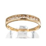 A 9ct yellow gold and diamond ten-stone half eternity ring, channel set round brilliant-cut diamonds
