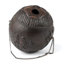 An antique Georgian carved coconut bug bear powder flask, carved with various motifs including