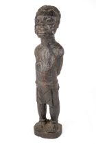 An African carved wooden slave figure in chains and chocker , 37 cm. In good condition