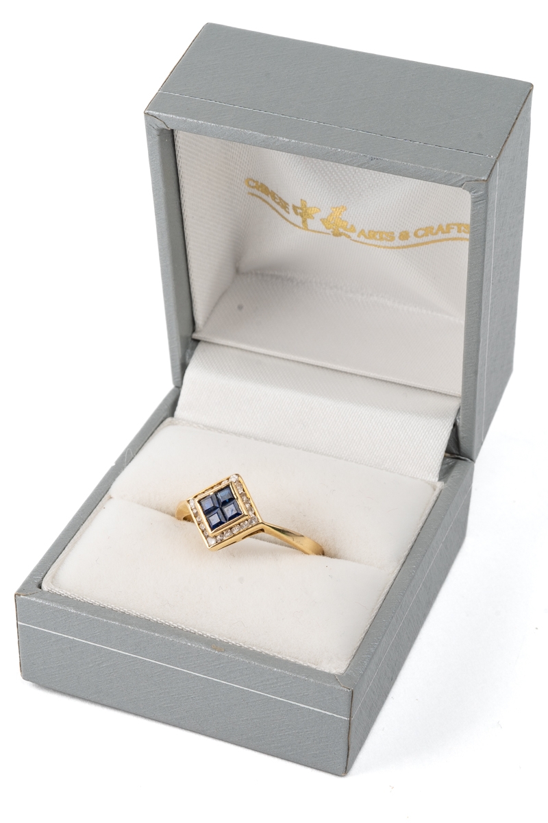 A 14k yellow gold sapphire and diamond ring, set with four square-cut sapphires surrounded by - Image 5 of 5