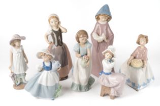 A collection of seven Nao girl figures, tallest 26 cm tall In good overall condition