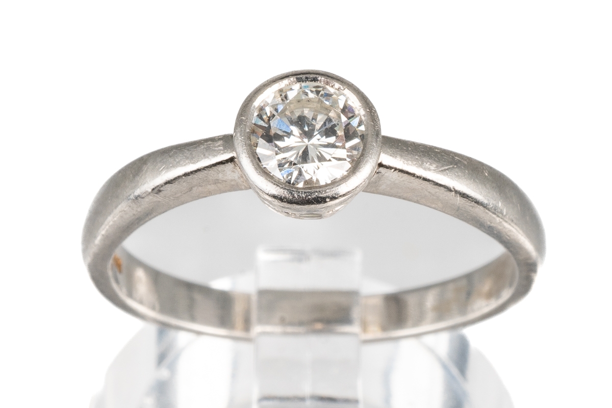 A platinum and diamond solitaire ring, set with a round brilliant-cut diamond approx 0.35ct in a