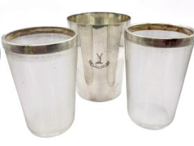 Two large ribbed glass tumblers with silver collars hallmarked for Birmingham 1896/97 together