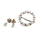 A white metal and pearl circular wreath brooch, set with ten 4mm cultured pearls with textured