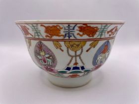 A Chinese bowl, everted rim, the centre with enamelled lotus flower, the exterior enamelled with