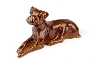 A salt glazed model of a reclining dog / boxer, aprox 15cm long, 8cm high