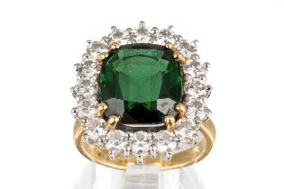 An 18ct yellow gold green tourmaline and diamond square cluster ring, the cushion cut tourmaline