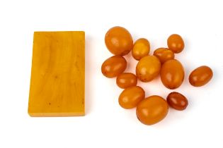 A collection of amber beads, together with a rectangular piece of amber (27g)