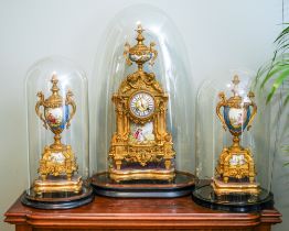 A 19th Century French gilt metal mounted Sevres style clock garniture, the panels painted with