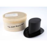 A vintage black Bakelite top hat perfume bottle holder, stamped Savile Reg No 820773, in oval box