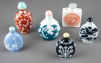 A collection of Chinese snuff bottles, including moulded cameo glass in monochrome and polychrome;