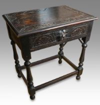 A 17th Century style painted oak side table, the rectangular top with incised sunbeam decoration