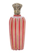 A 19th century milch glass scent bottle, with ruby flash and gilt stripes, silver hinged cover,