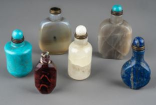 A collection of Chinese hardstone snuff bottles, including lapis lazuli, reconstituted turquoise,