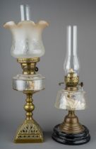 Two Victorian oil lamps, tallest measuring 63 cm