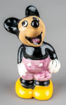 A 1930s ceramic figure of Mickey Mouse, grey shorts with yellow shoes, stamped W.F, ENG to base,