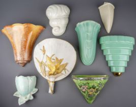 A collection of ceramic early 20th Century wall pockets, various designs and shapes including