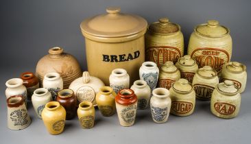 A collection of earthenware to include: Victorian style cream jars with transfer printed labels,,