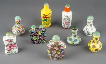 A collection of Chinese porcelain snuff bottles, of various shapes and designs, including baluster