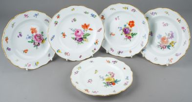 A set of five early 20th Century Meissen side plates, decorated with insects and floral bouquets and