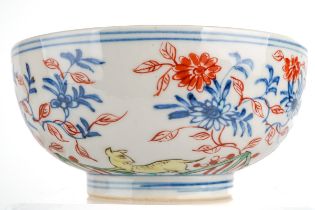 A pair of Chinese bowls, decorated with animals amongst foliage, the inner bowls painted with