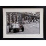 Motor racing interest - Sir Stirling Moss autograph - A black and white photograph of the 1961