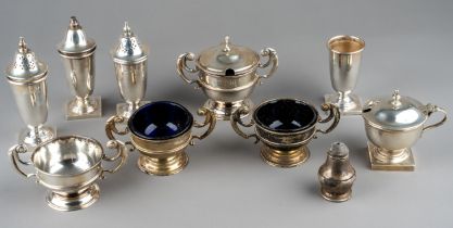 A set of three silver open salts and a mustard pot and cover, Chester 1904, three with blue glass