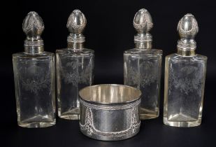 A set of four French silver-mounted engraved glass scent-bottles, first quarter 20th Century, the