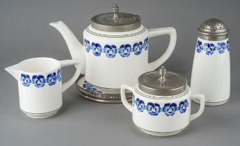 An early 20th Century German Wächtersbach Blue Pansy chrome mounted ceramic breakfast set, to