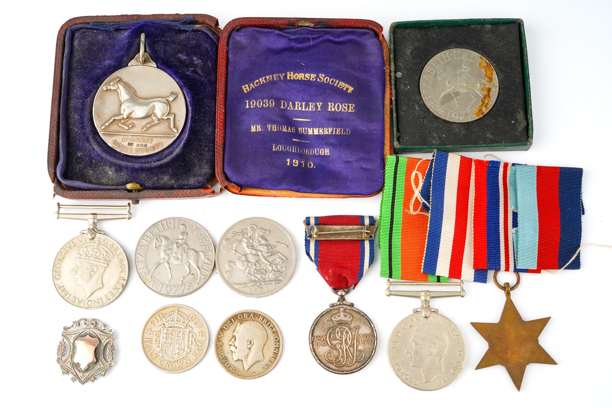 A World War II trio of medals, unnamed; a George V and Queen Mary 1910-1935 Jubilee medal; a - Image 2 of 2