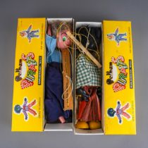 Two vintage Pelham Puppets to include: Golliwog with gingham jacket and striped trousers, box with