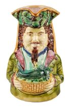 Majolica jug in for of a man holding a game dish with a rabbit on it, approx. 20 cm tall Some
