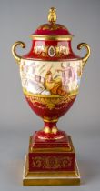 A large 19th century Royal Vienna hand painted urn, with beehive marks, scenes depict Jupiter and